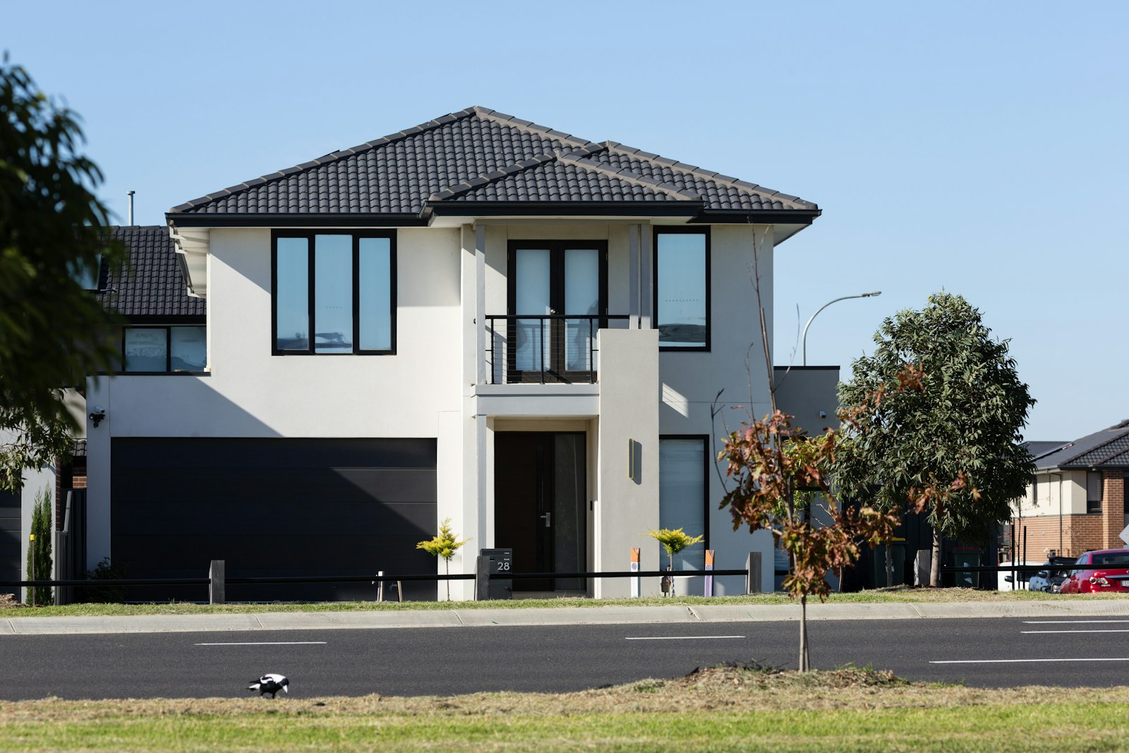 Dark garage door on a two-story house