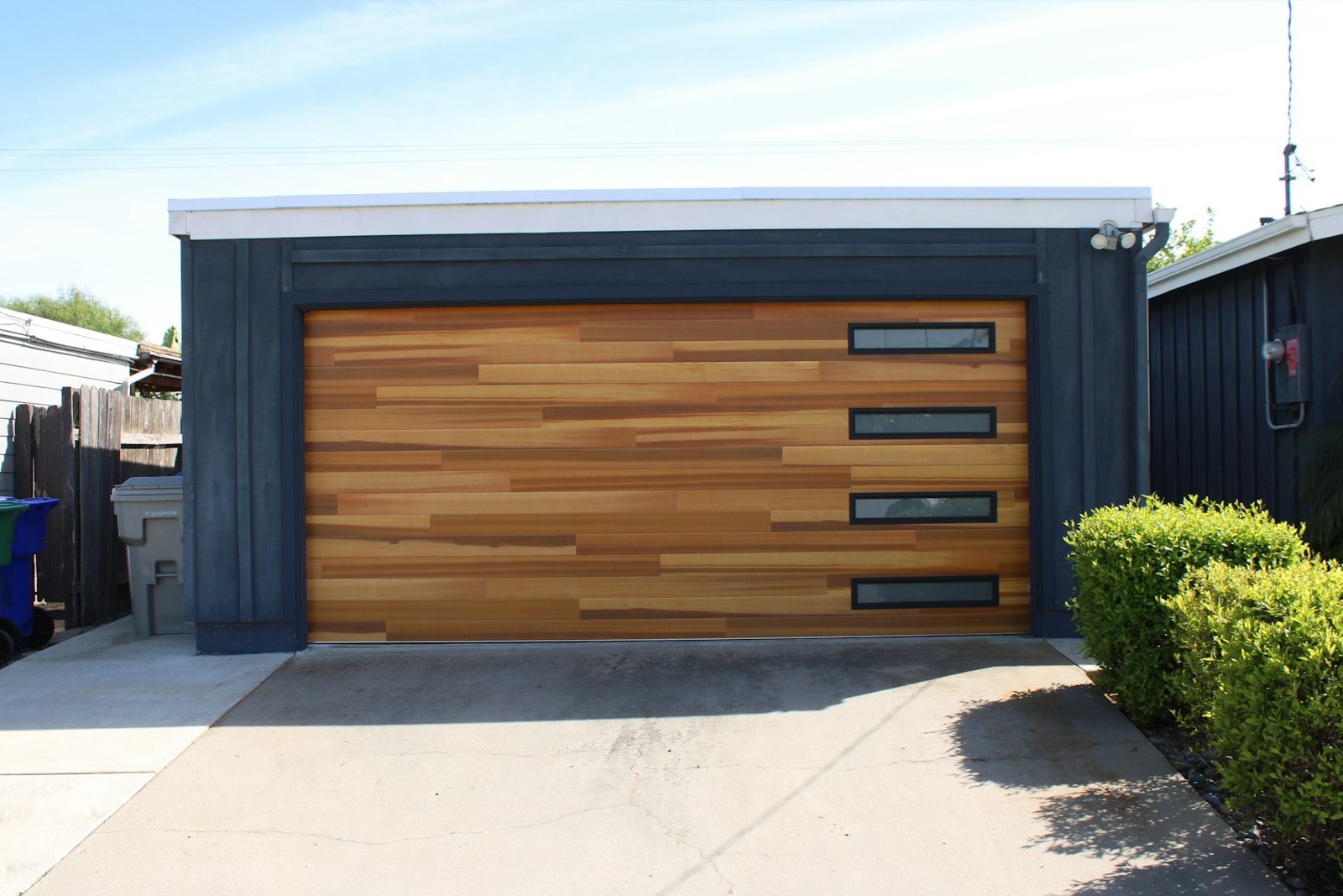 Wood-look garage door with window inserts