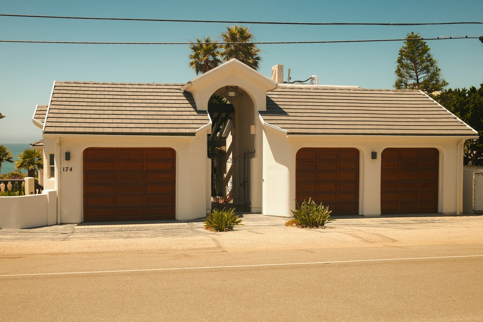 Residential garage with three wooden doors